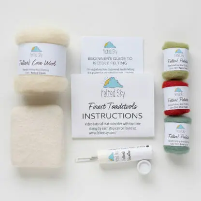 A detailed view of the supplies included in the forest toadstools needle felting kit.