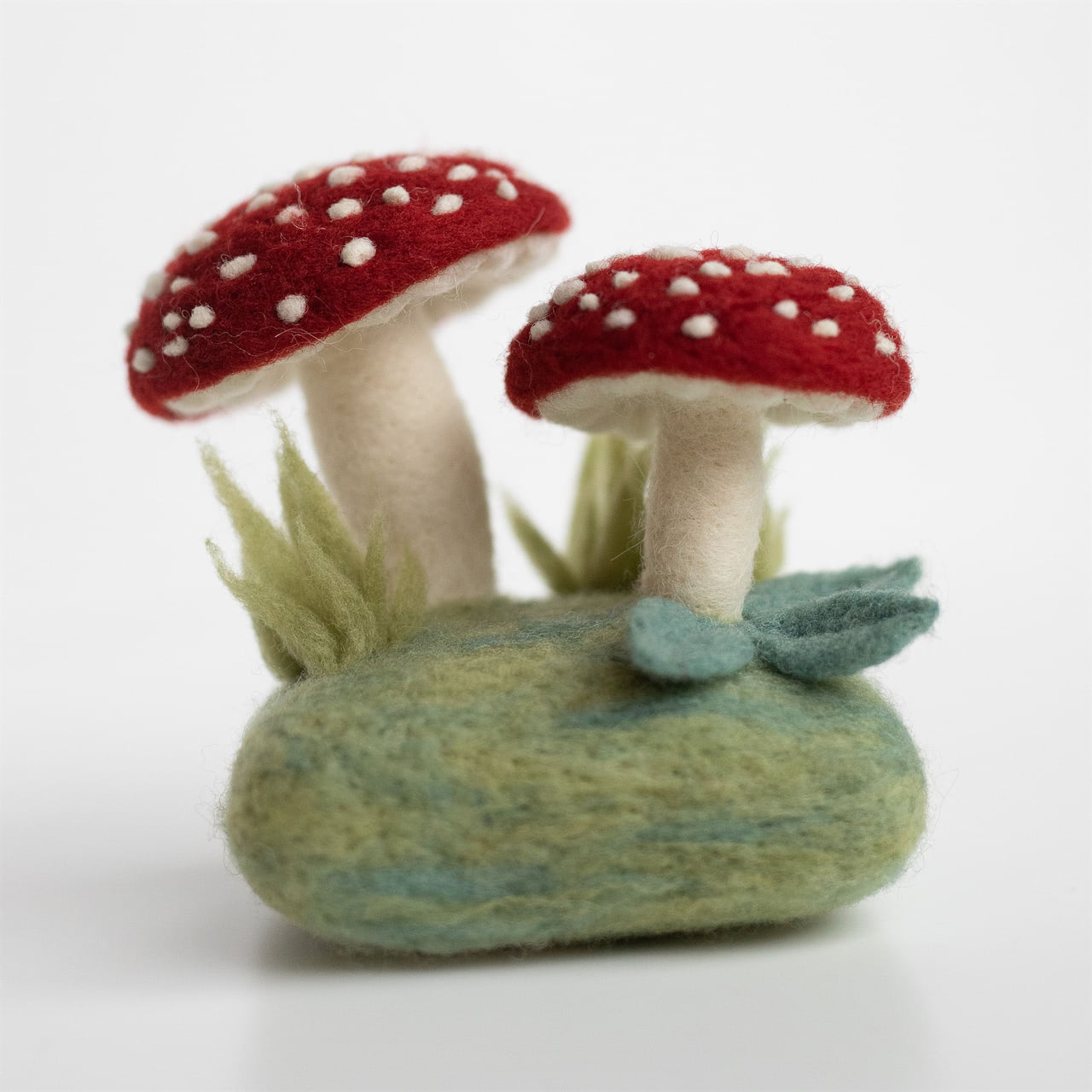 A kit to create a needle felted forest toadstool sculpture.