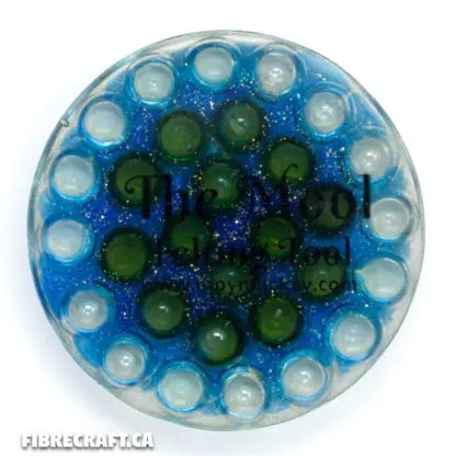 Top view of the handcrafted wet felting tool with waterproof resin and glass marbles