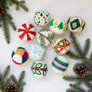 Needle felted Christmas ornament kit with 10 handmade ornaments in festive designs including peppermint swirl, snowflake, geometric patterns, and holiday trees.